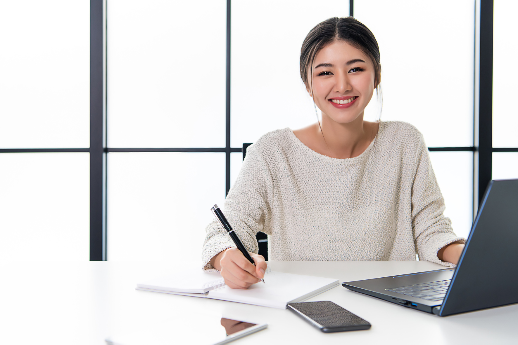 Asian working woman is working on her labtop. Working from home with relax.